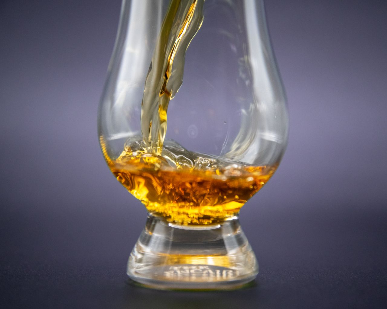 mission-img Close-up of golden whiskey being poured into an elegant glass.